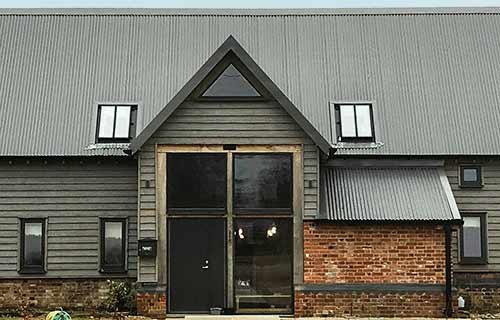 P and F Cladding - Suffolk - corrugated sheeting roof on barn conversion