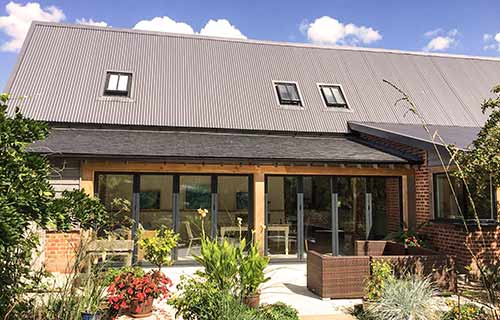 P and F Cladding - Suffolk - corrugated sheeting roof on barn conversion