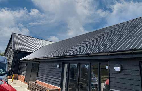 P and F Cladding - Wickham: corrugated Tata System and flashings